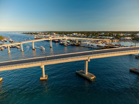 New Providence, The Bahamas - 03 January 2026: Aerial view of Paradise Island Bridge spanning the harbor with boats, clear blue water, and coastal landscape under a clear sky.