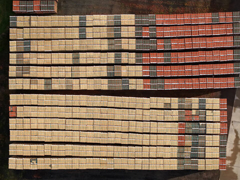 Scoresby, Australia - 09 September 2026: Aerial view of PGH Bricks Pavers Selection Centre showing rows of stacked bricks and pavers in various colors and textures arranged in an industrial yard.
