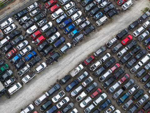 Dandenong, Australia - 13 September 2026: Aerial view of Jollys Auto Parts Dandenong showing rows of salvaged vehicles parked in an organized yard.