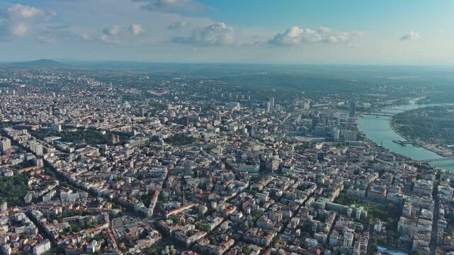 Aerial view of Belgrade with Sava and Danube rivers, historic fortress, urban skyline, bridges, parks, and waterfront landscape Serbia, 4k