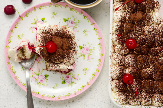 Sour cherry tiramisu  in the mold and on the plate top veiw .selective focus.