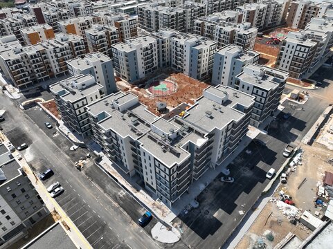 GAZİANTEP NURDAĞI TOKİ KONUTLARI DRONE 
Wide Drone Shot of Large Modern Residential Housing Complex Architecture

Aerial View of Contemporary Apartment Buildings Block with Courtyard

 Real Estate