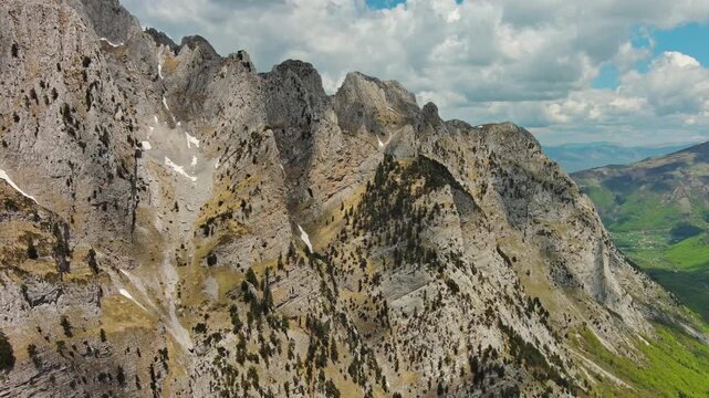 Aerial view of amazing rocky mountains in snow, Prokletie park, Montenegro and Albania, 4k