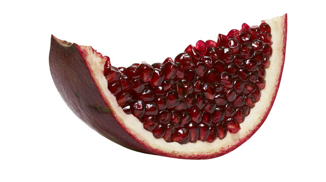 Isolated fresh vibrant red pomegranate slice with juicy arils, healthy organic delicious fruit.