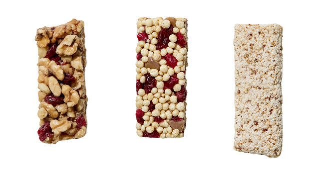 Isolated nutritious trio of energy snack bars made with fruits, nuts, and crunchy puffed grains.