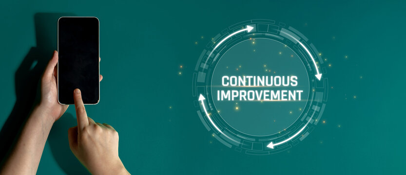 Hand Holding Smartphone with Emphasis on Continuous Improvement Concept in a Modern Digital Environment Sigmoid