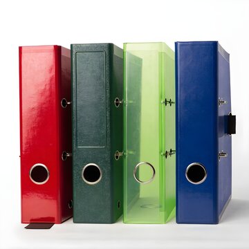 Four colorful office ring binder folders standing in a row on a table