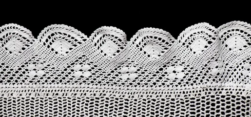 Crochet lace patterns border, crocheted Grandma's Doily corner, detail of hand-crocheted embroidery, tablecloth, napkin isolated on black background border art design. Craft, vintage linen. Flat lay © Subbotina Anna
