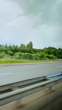Tranquil highway scene with lush greenery and overcast sky