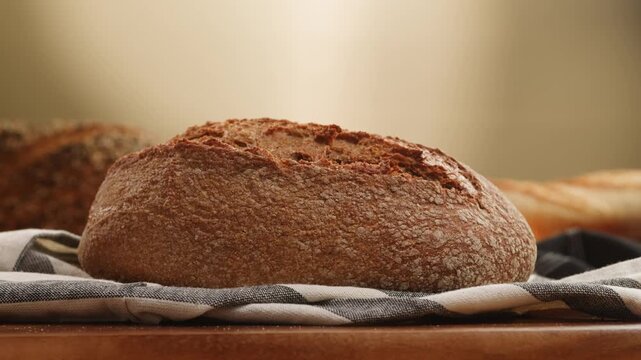 Bread table, healthy Rustic Spanish table with assorted European bread, whole grain loaf, seeded bread and small baguette