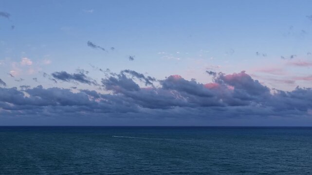 Horizon sunrise sky hyperlapse. Sunrise seascape. Hyperlapse summer seascape. Sea cloudscape horizon hyperlapse. Sunset cloudy sky. Skyscape at summer vacation. Skyscape with sea sunset footage