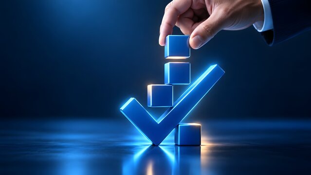 Hand placing a blue cube on a stack beside a glowing checkmark. Concept of corporate quality assurance and strategic business completion.