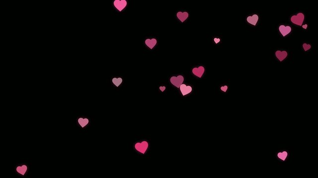 Animated pink and red hearts floating and drifting slowly on a solid black background