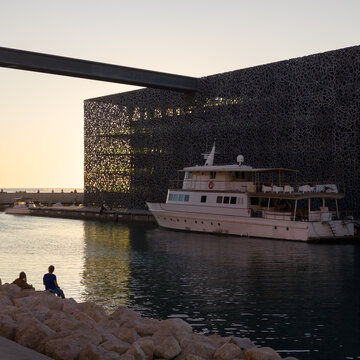 MARSEILLE, FRANCE - SEPTEMBER 16, 2026 - MuCEM building standing near a yacht moored in Marseille, France