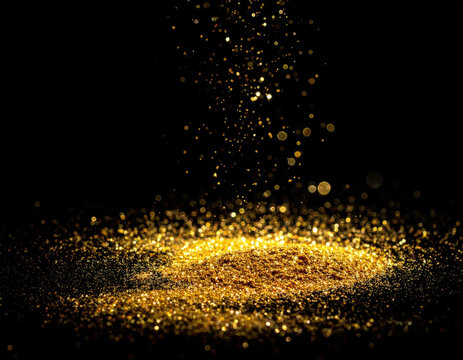 Golden glitter particle cloud falling onto sparkling powder surface against dark background, creating dramatic luminous celebration scene with rich texture and depth