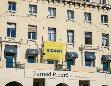 MARSEILLE, FRANCE - SEPTEMBER 16, 2026 - Pernod Ricard Club Marseille building showing windows and a Ricard banner