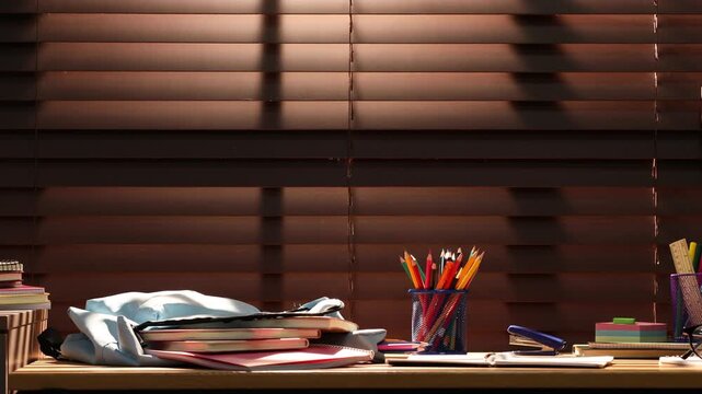 Stylish backpack with different stationery, glasses and apple on wooden desk indoors, camera moving right