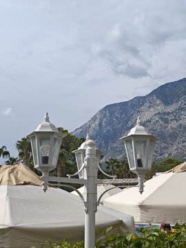 Vintage street lamps with mountain view outdoors