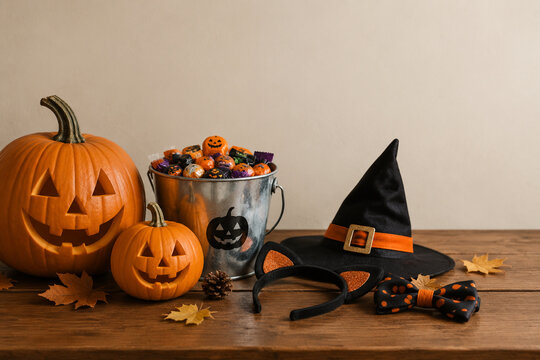 Mantel with candy bucket and pumpkins, Halloween home decor and seasonal celebration concept
