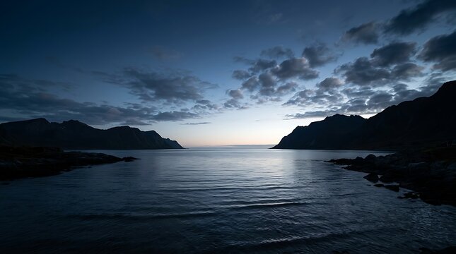 Dark sea and mountain silhouettes at twilight