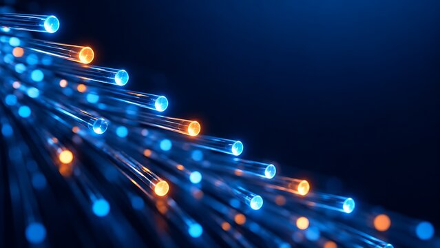 Detailed close up of glowing fiber optic cable endpoints transmitting digital data in blue and orange
