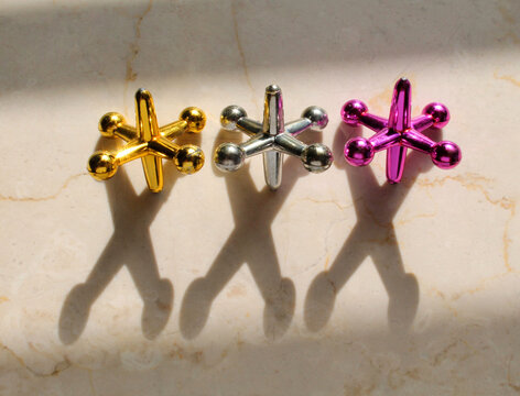Three-colored jacks in a sunbeam