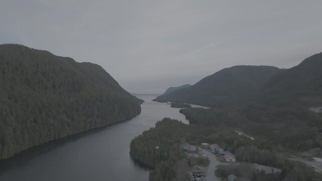 Aerial view of a remote coastal inlet and forested shoreline in the Great Bear Rainforest, British Columbia &mdash; looking down the inlet