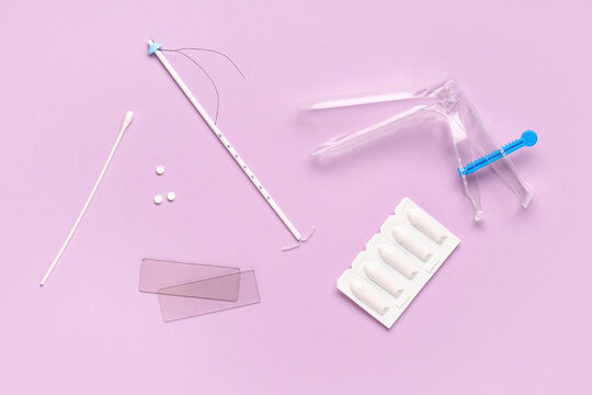 Gynecological health and contraception, intrauterine device with vaginal speculum and medical supplies for reproductive wellness checkup on purple background