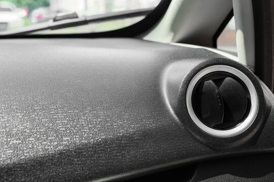 Automotive climate control and air conditioning, car interior dashboard with circular ventilation vent and textured surface in modern vehicle cabin