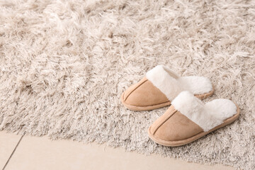 Comfort and relaxation at home, pair of soft cozy slippers on a fluffy rug for a peaceful lifestyle and leisure time in a warm living room interior © Pixel-Shot