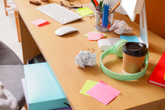 Burnout and workplace stress, messy office desk with coffee and crumpled paper deadline pressure and lack of productivity in remote work