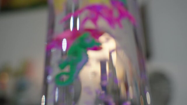 Toy fish floating in a bubble tube display