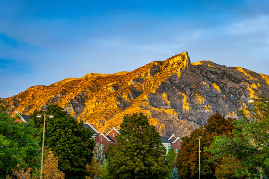 Golden hour sunlight illuminates Y Mountain above Brigham Young University