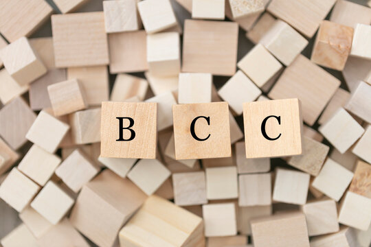 BCC, blind carbon copy concept. Abstract geometric wooden dice. BCC icon.