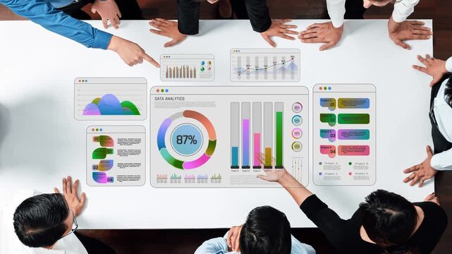 Diverse Business Team Analyzing Data Analytics Dashboard on Modern Table with Colorful Graphs and Charts for Effective Decision Making Sigmoid