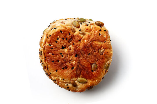 Healthy multigrain bread bun topped with mixed seeds and grains