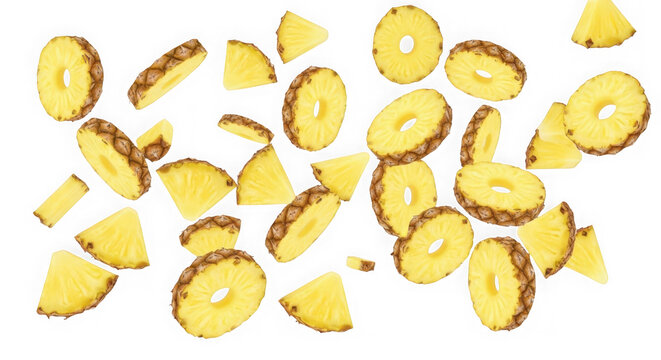 Fresh pineapple slices and chunks falling down isolated on transparent background