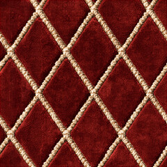 Obraz premium Seamless pattern red velvet fabric forming a quilted diamond pattern with decorative gold and beige trim, creating a rich, opulent texture