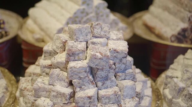 turkish delights displayed in a market setting during a busy afternoon