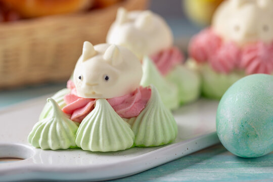 Easter cheesecake or marshmallow bunnies on a plate.