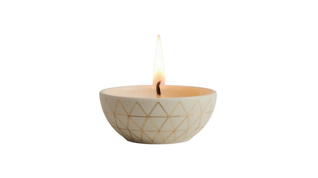 White ceramic bowl with geometric patterns holds a lit candle for a serene ambiance.