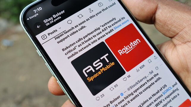 Person holding smartphone displaying news about ast spacemobile and rakuten partnership for satellite mobile networking. Kolkata, West Bengal, India, September 11, 2026