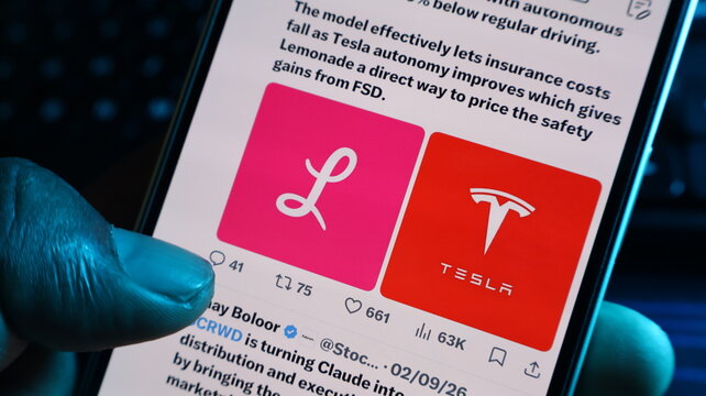 Lemonade and Tesla logos on smartphone screen showing autonomous driving and insurance integration news with finger touch. Kolkata, West Bengal, India, September 11, 2026