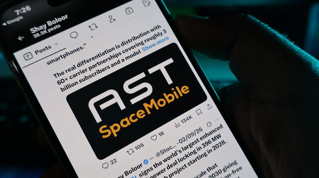 Ast spacemobile logo on smartphone screen held by hand in dark lighting showing social media post about connectivity. Kolkata, West Bengal, India, September 11, 2026