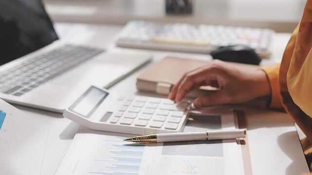 Businesswoman holding document working at laptop pc computer doing online tax invoice, financial report. Focused Hispanic business woman manager specialist with paperwork in office. Banner, copy space