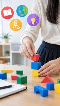 Educational concept featuring colorful building blocks and academic icons for creative learning and development strategy.