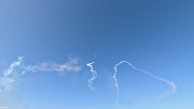 Aerobatic Jet Performing Stunts with Smoke Trails at Pacific Airshow