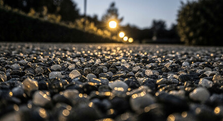 Fototapeta premium Glistening Pebbles Reflecting Twilight Lights Macro View