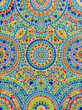 Colorful mosaic tile pattern with intricate circular geometric shapes and vibrant tessellated design