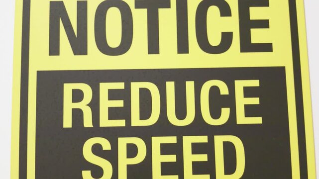 Yellow and Black Notice Reduce Speed When Entering Tunnel Safety Sign